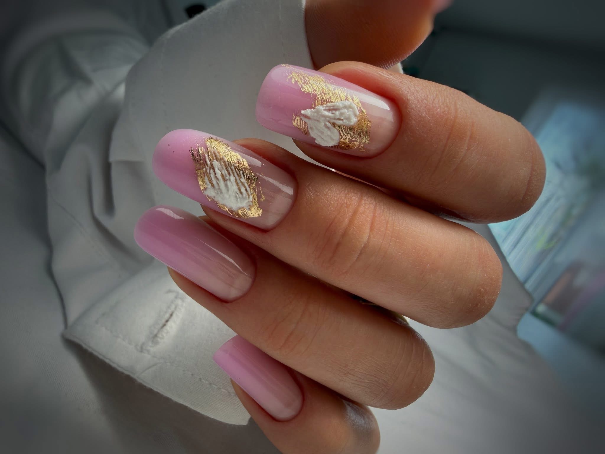 Minimalist milky nude and soft pink gel nails in a stylish coffin shape.