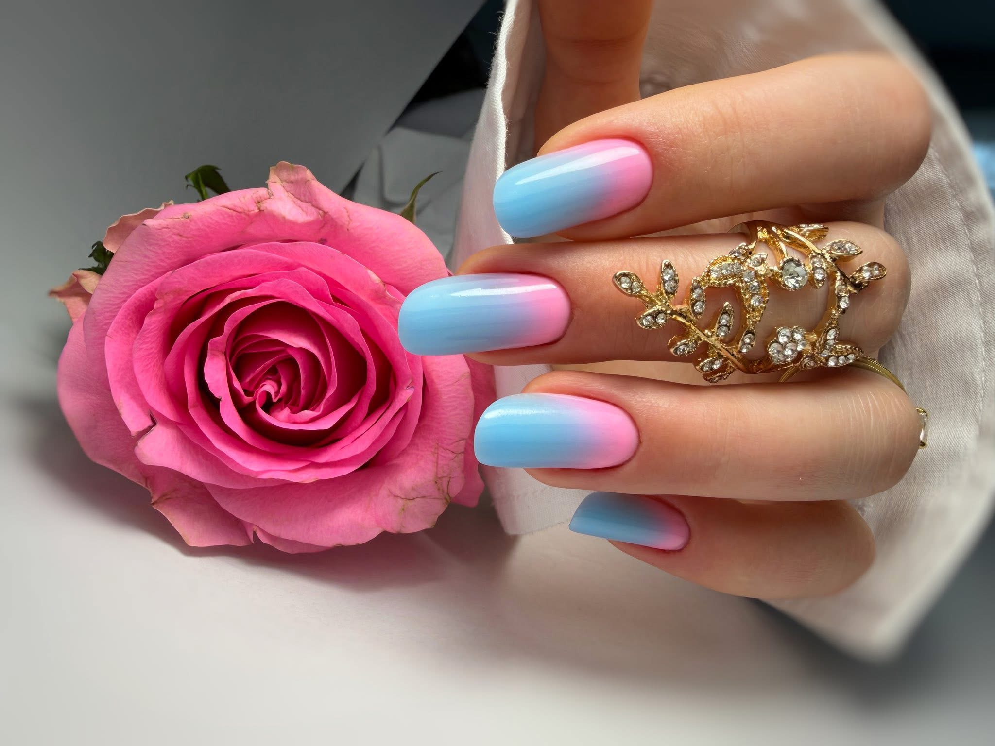 Modern french manicure with crisp white tips on square-shaped gel extensions.